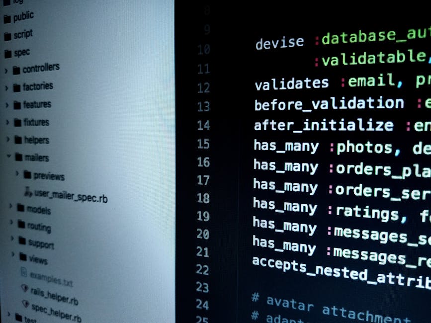 Close-up view of a laptop screen displaying a computer code editor with visible lines of programming code in a light-colored interface. The screen is set against a dark background, with the keyboard i